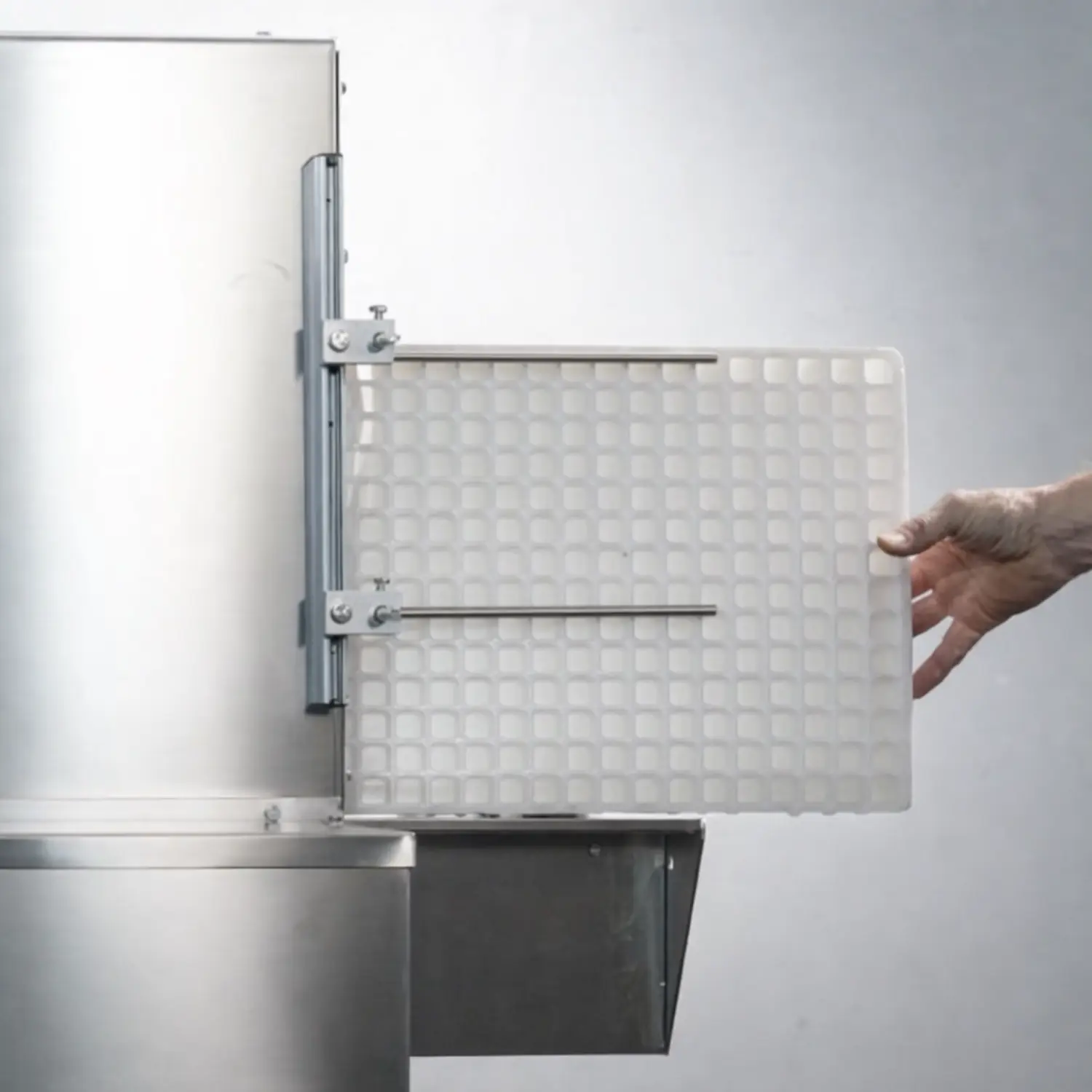 Clean seedling tray being removed from a tray washer after the washing process