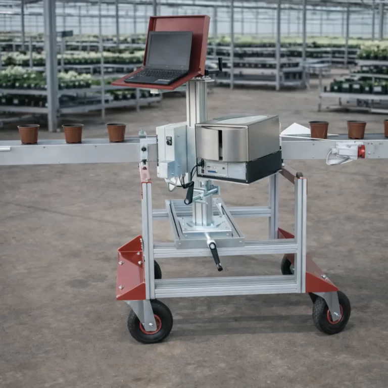 Pot labeling machine installed in an industrial greenhouse with conveyor system