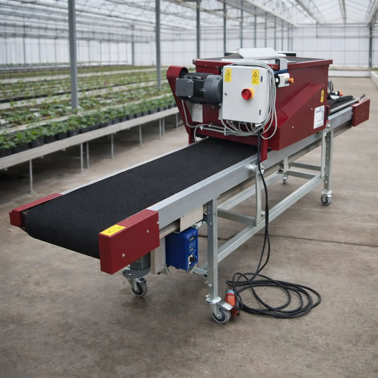 Detailed view of tray filler filling planting trays with potting soil